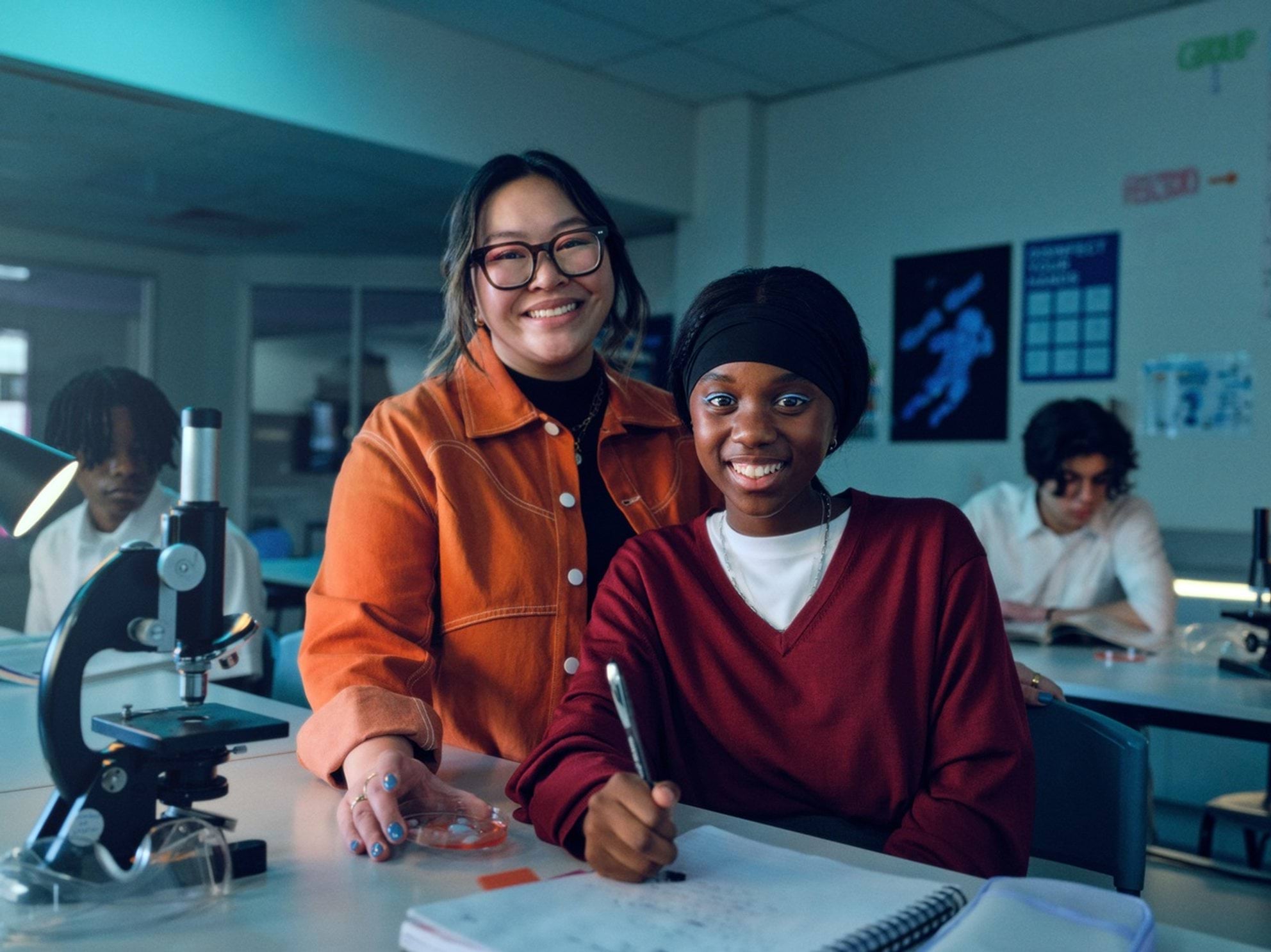 Teacher in a science lab with student.